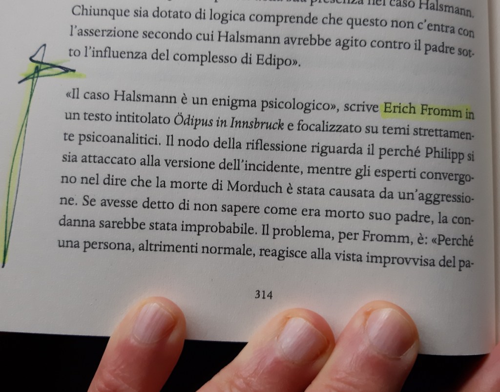 Close-up of a hand holding a book open to a page discussing Erich Fromm's analysis of the Halsmann case, with highlighted text emphasizing key psychological themes.