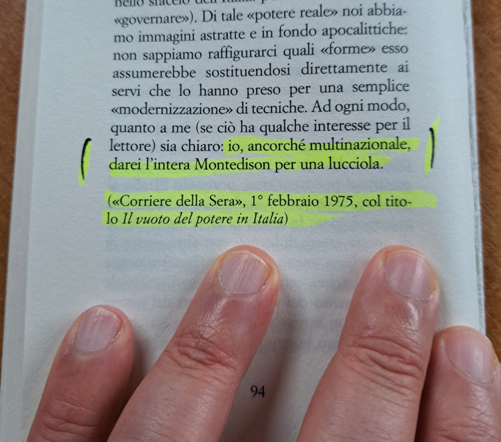 A close-up of a page from a book with highlighted text and a person's fingers pointing at the text.