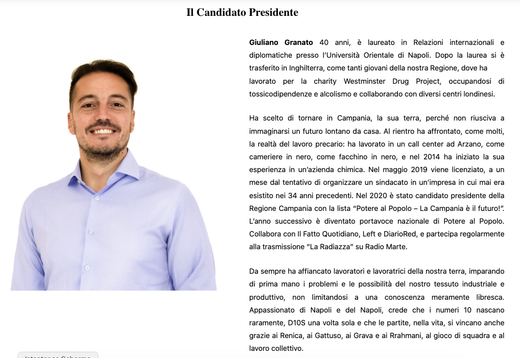 Ritratto di Giuliano Granato, candidato presidente, con una camicia chiara e un sorriso, di fronte a uno sfondo neutro.