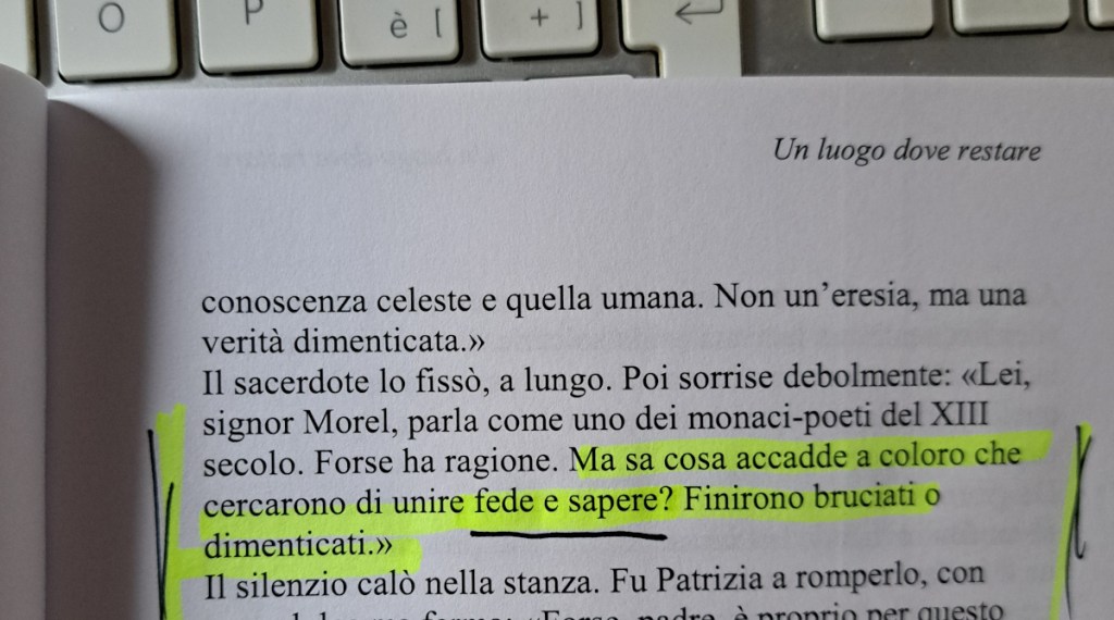 A close-up of a printed page from a book featuring highlighted text, with visible keyboard keys in the background.